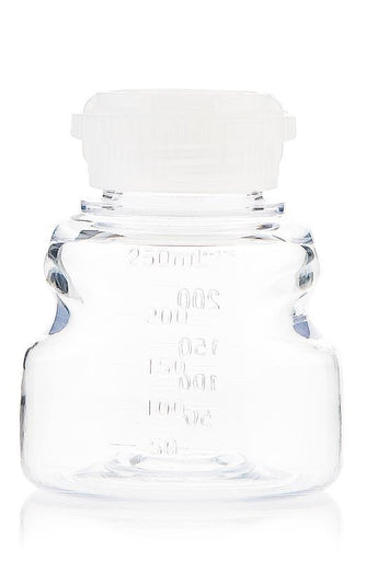 Clear glass bottle with a white cap on a white background
